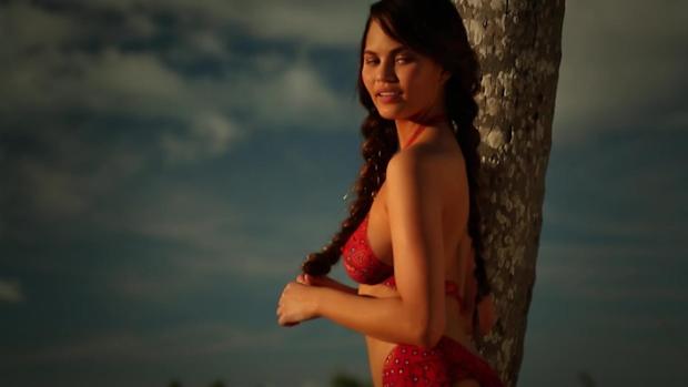 Chrissy Teigen wears nothing but paint